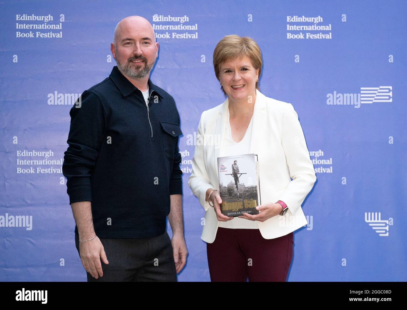 First Minister Nicola Sturgeon with Douglas Stuart before attending the Edinburgh International Book Festival to discuss his bestselling novel Shuggie Bain. The Scottish First Minister is no longer self-isolating, after testing negative for coronavirus. Picture date: Monday August 30, 2021. Stock Photo