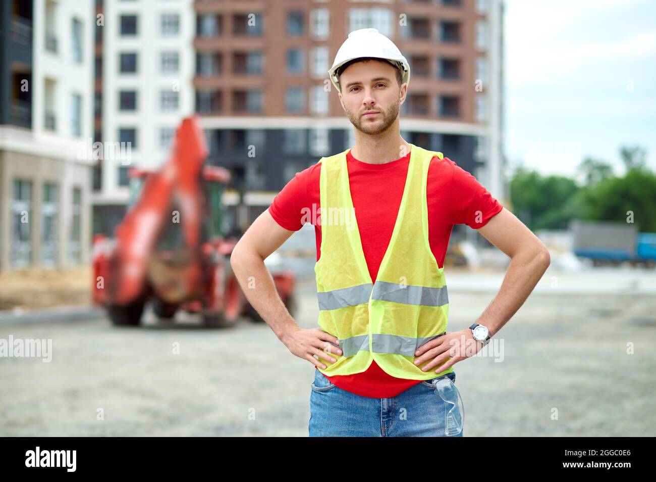 Serious young builder looking in front of him Stock Photo