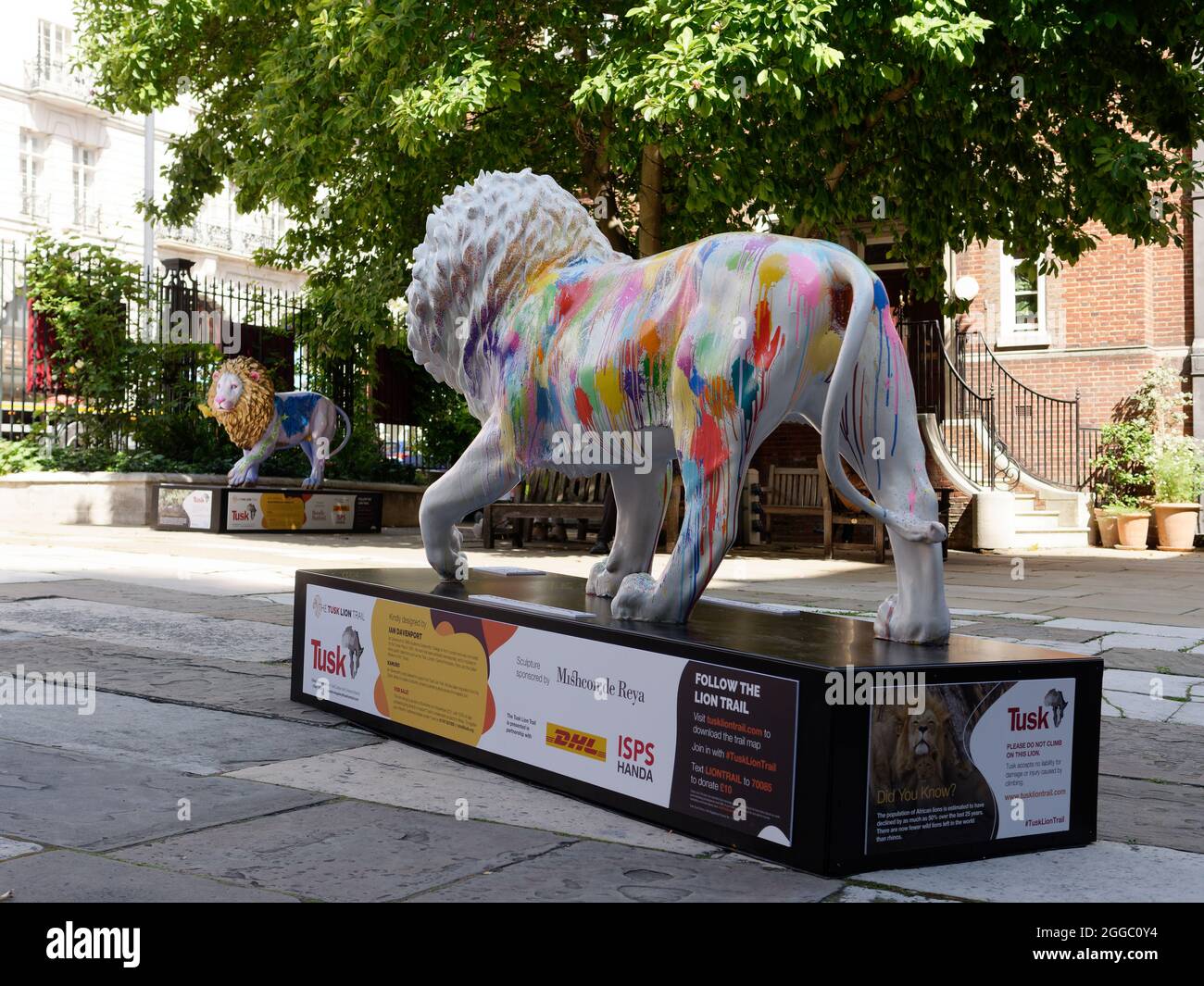 London, Greater London, England, August 24 2021: The London Pride Tusk Lion Trail, Kamuro by Ian Davenport with Worker by Helen Downie behind. Stock Photo