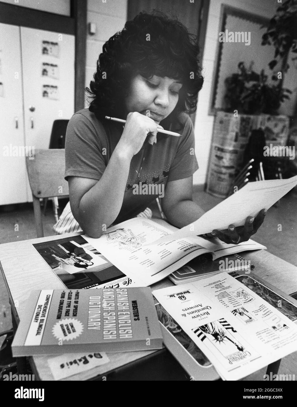 Austin Texas USA, 1989: Female Hispanic immigrant looks at worksheet ...