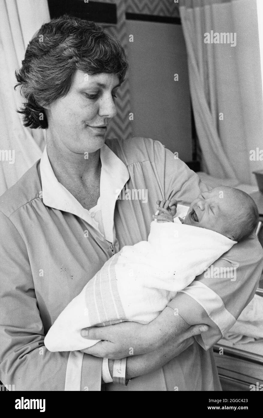 ©1980's Mother and baby who was born in-vitro fertilization (test tube baby) No release  NO ID's Stock Photo