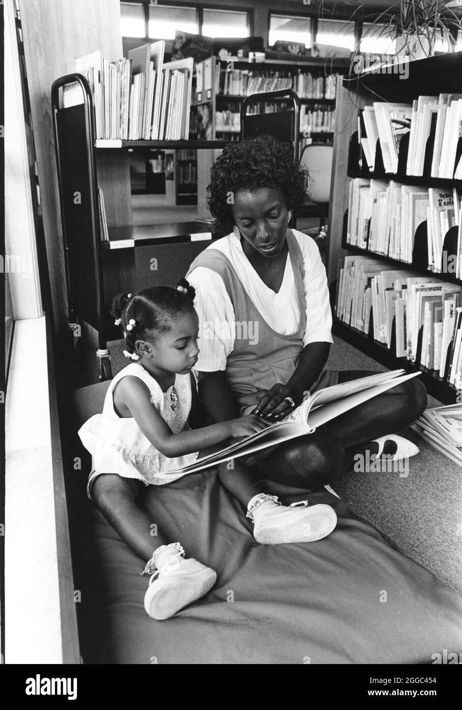 ©1992 Black mother and black child reading summertime reading program