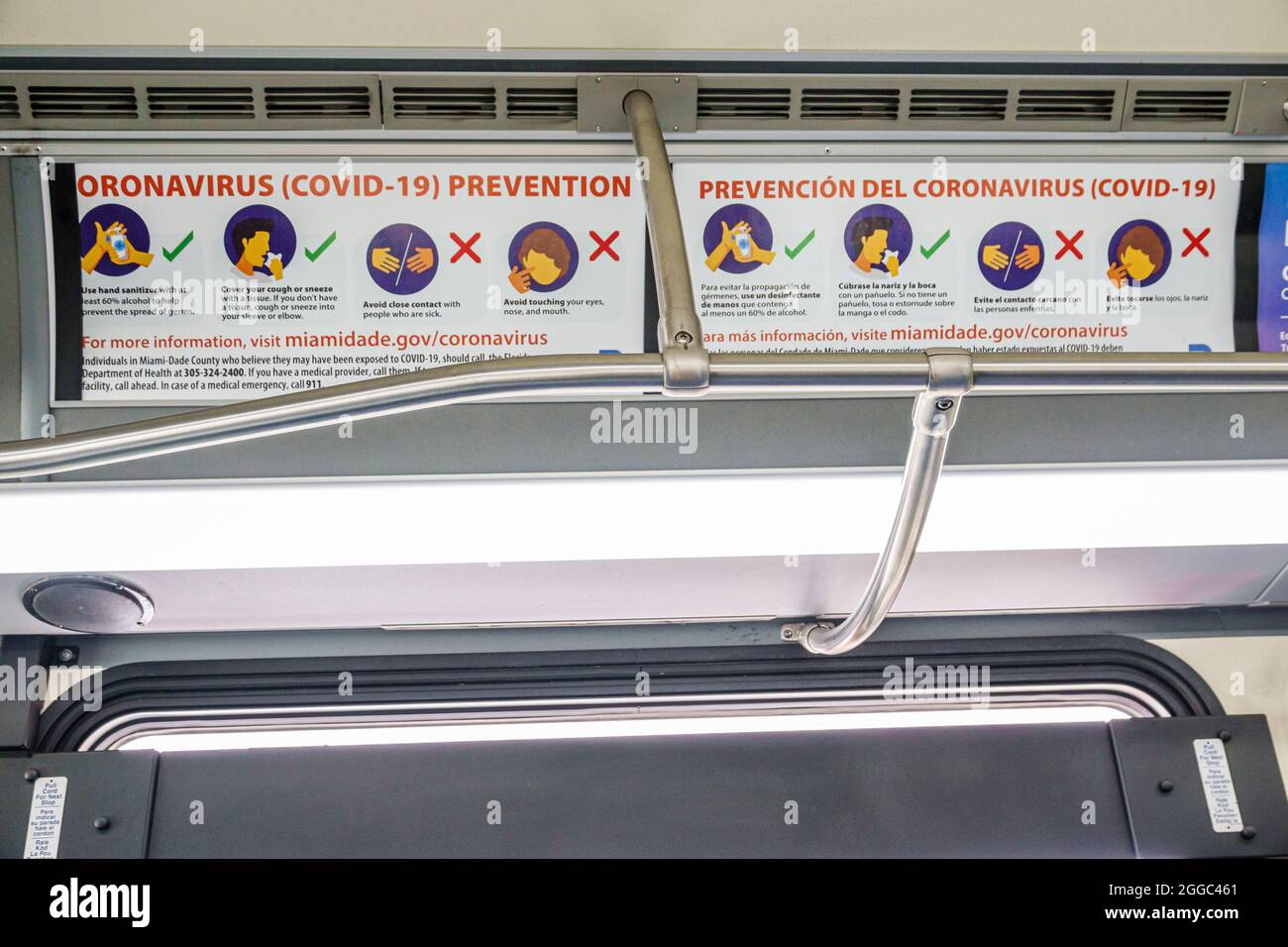 Miami Beach Florida Miami-Dade Metrobus bus public transportation onboard inside interior sign notice face covering mask required social distancing Co Stock Photo