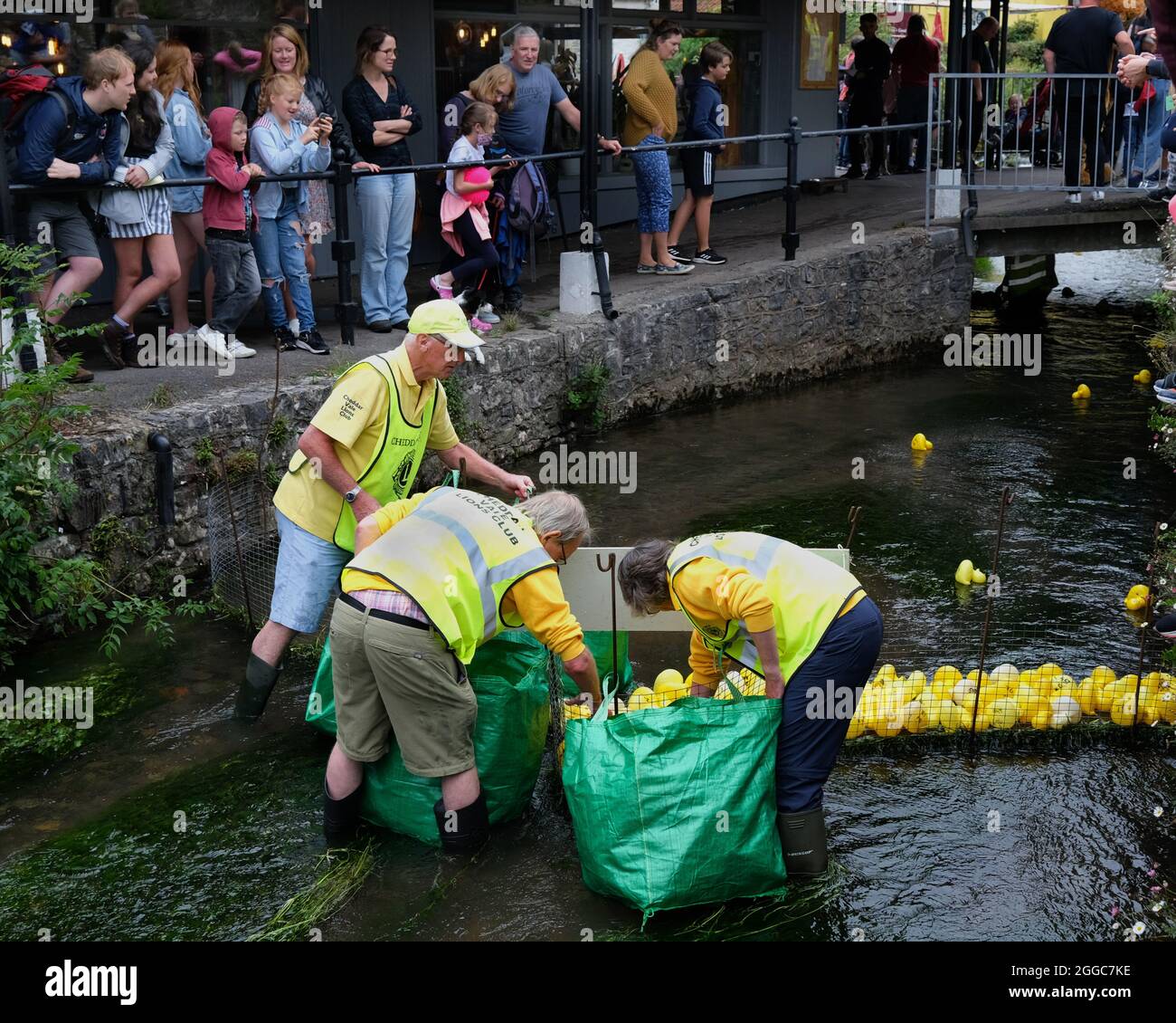 August 2021 - The village Lions club tidy up after their aunual duck race in the gorge Cheddar Somerset, UK. Stock Photo