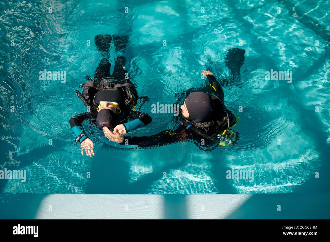 Female diver and male instructor, diving school Stock Photo