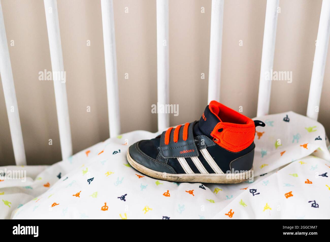 POZNAN, POLAND - Aug 10, 2021: A small child Adidas sports shoe on a bed  sheet Stock Photo - Alamy