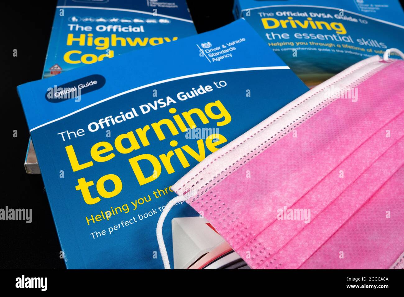 Viral face mask on top of The Official Highway Code, Official DVSA ...