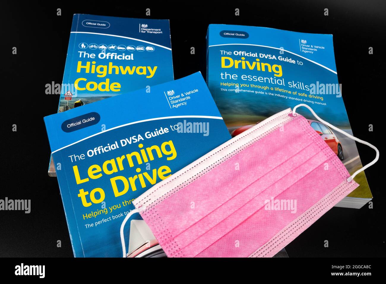 Viral face mask on top of The Official Highway Code, Official DVSA ...