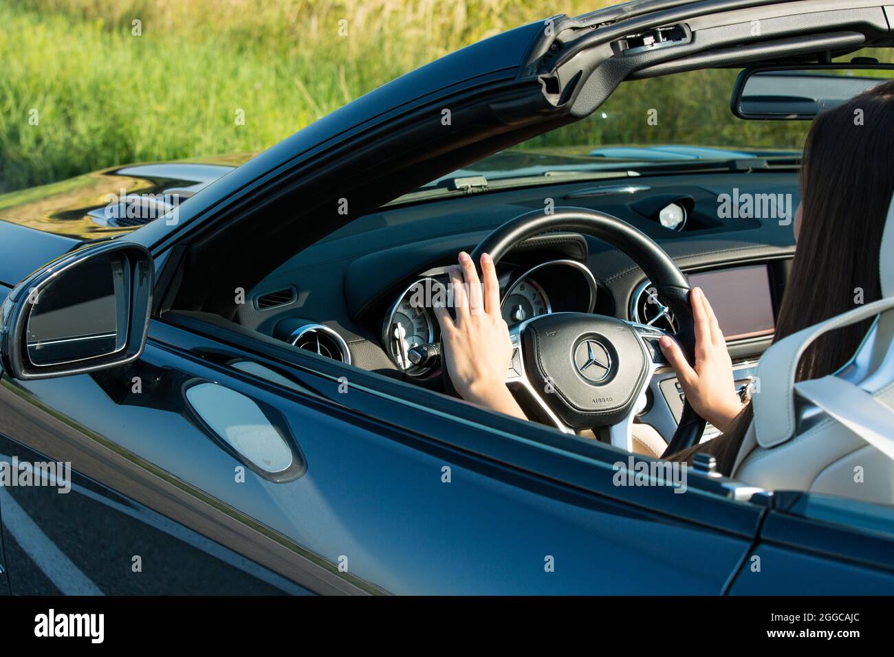 One woman driving luxury car hi-res stock photography and images - Alamy