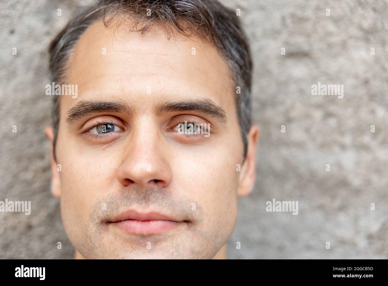 Close up portrait of latin man with heterochromia Stock Photo