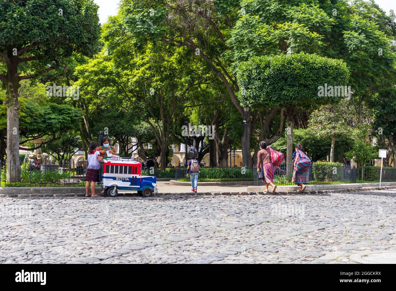 guatemalan woman selling ice cream on the park with a colorful cart Stock Photo