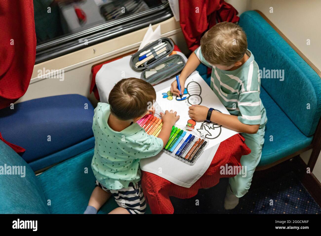Brother Train Ride Funny little brothers travel by train riding at comfortable railway ...