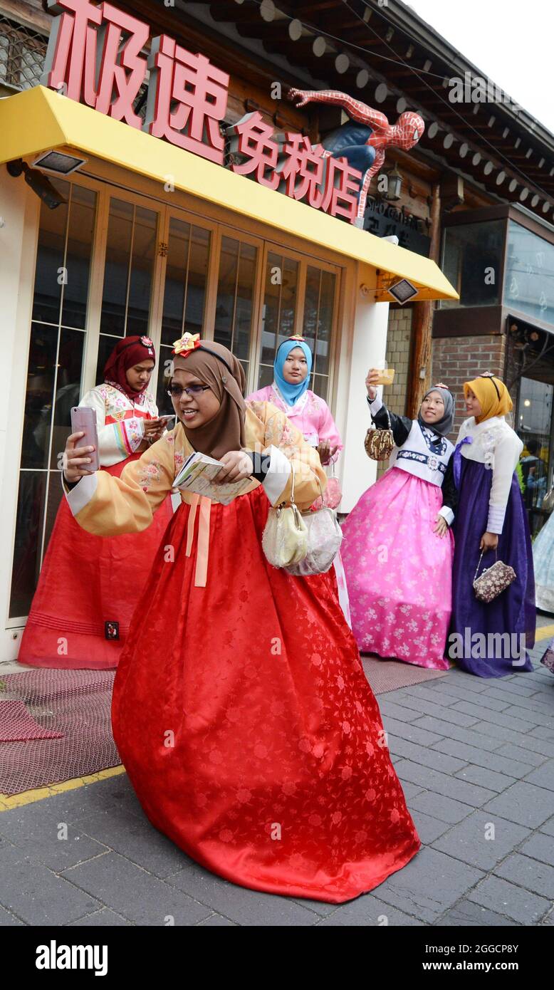Malaysian tourist dressed in traditional Korean clothing at the Bukchon
