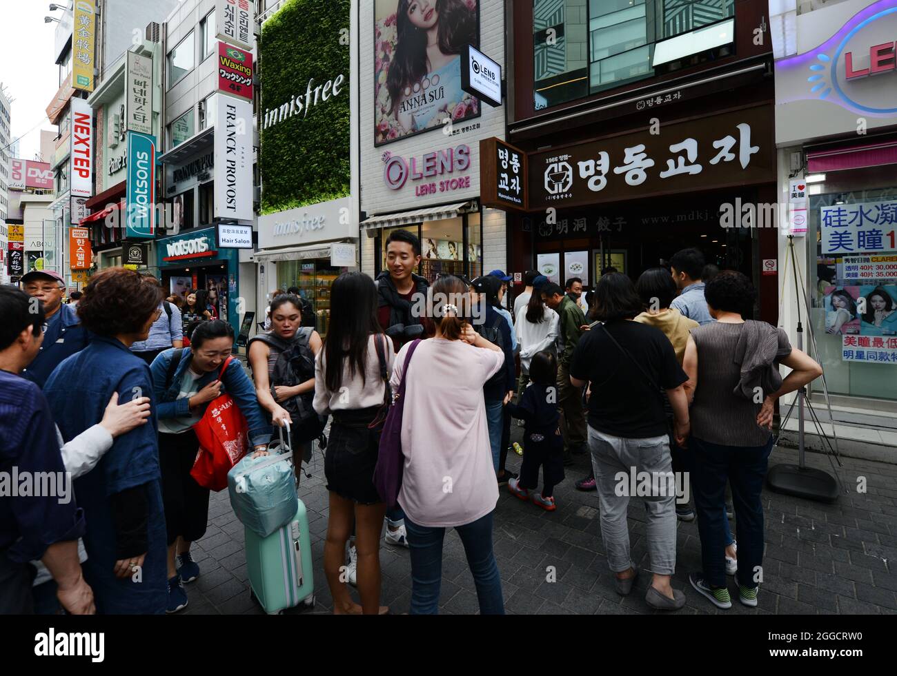 Standing in line and waiting to enter the Myeongdong Kyoja restaurant in Myeongdong, Seoul, South Korea. Stock Photo