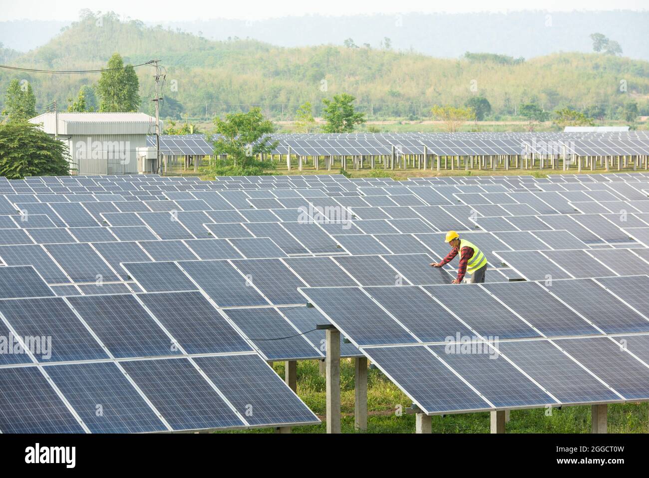 solar power station,Solar panels with technician,Future electrical production, asian engineers Stock Photo