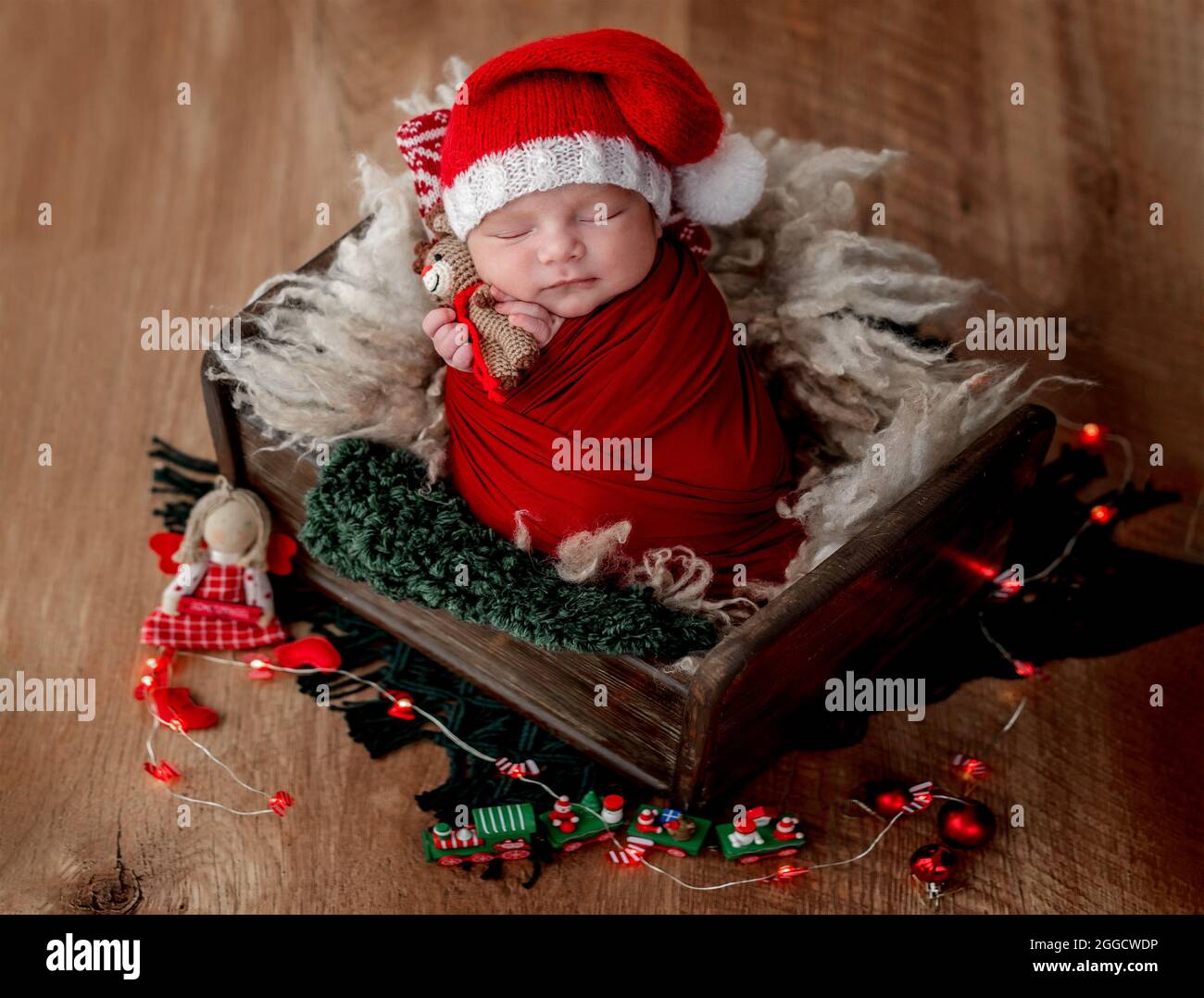 Cute newborn baby wearing santa hat Stock Photo