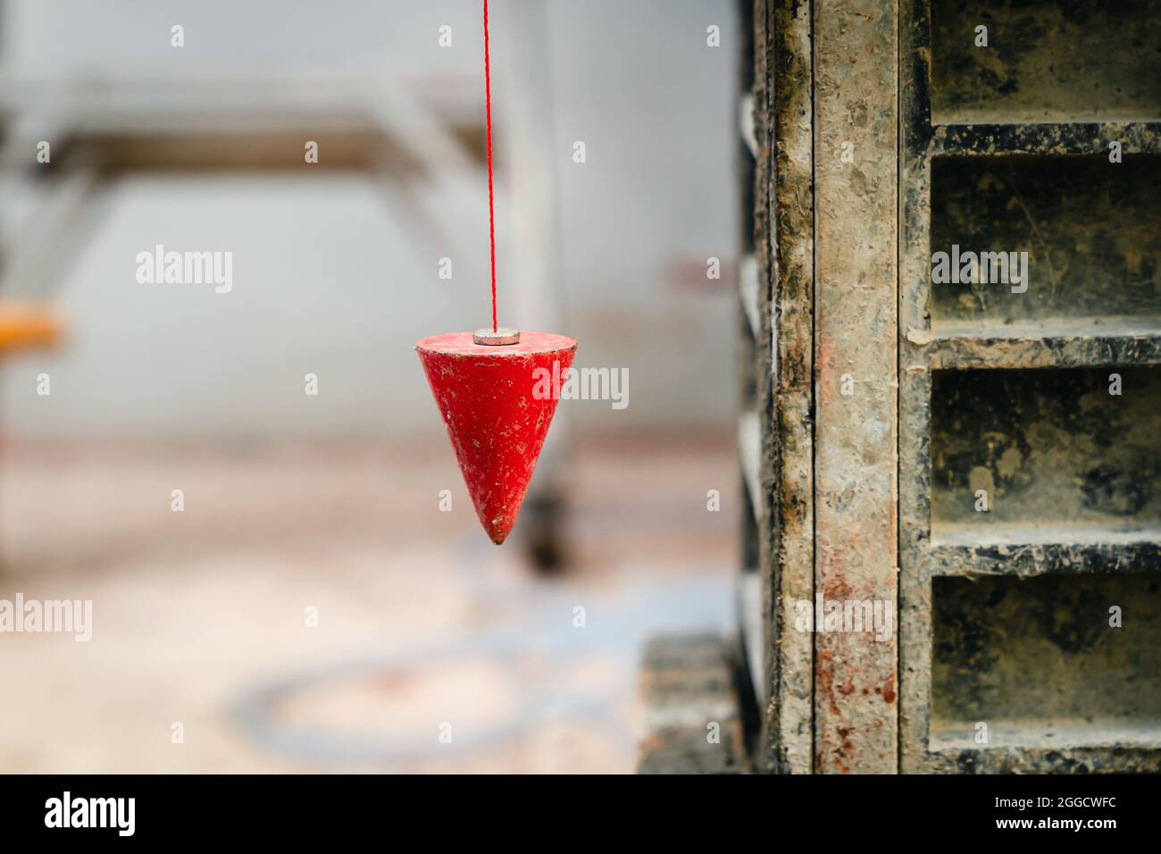 pendulum with plum for finding vertical line Stock Photo