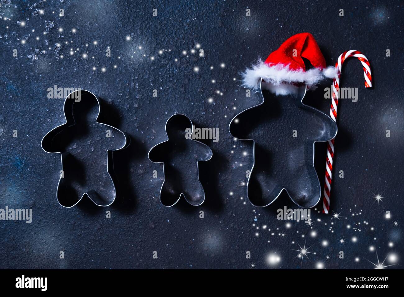 Christmas Cookie Cutters In Shape Of Gingerbread Mans. Happy Family Holidays Concept Stock Photo - Alamy