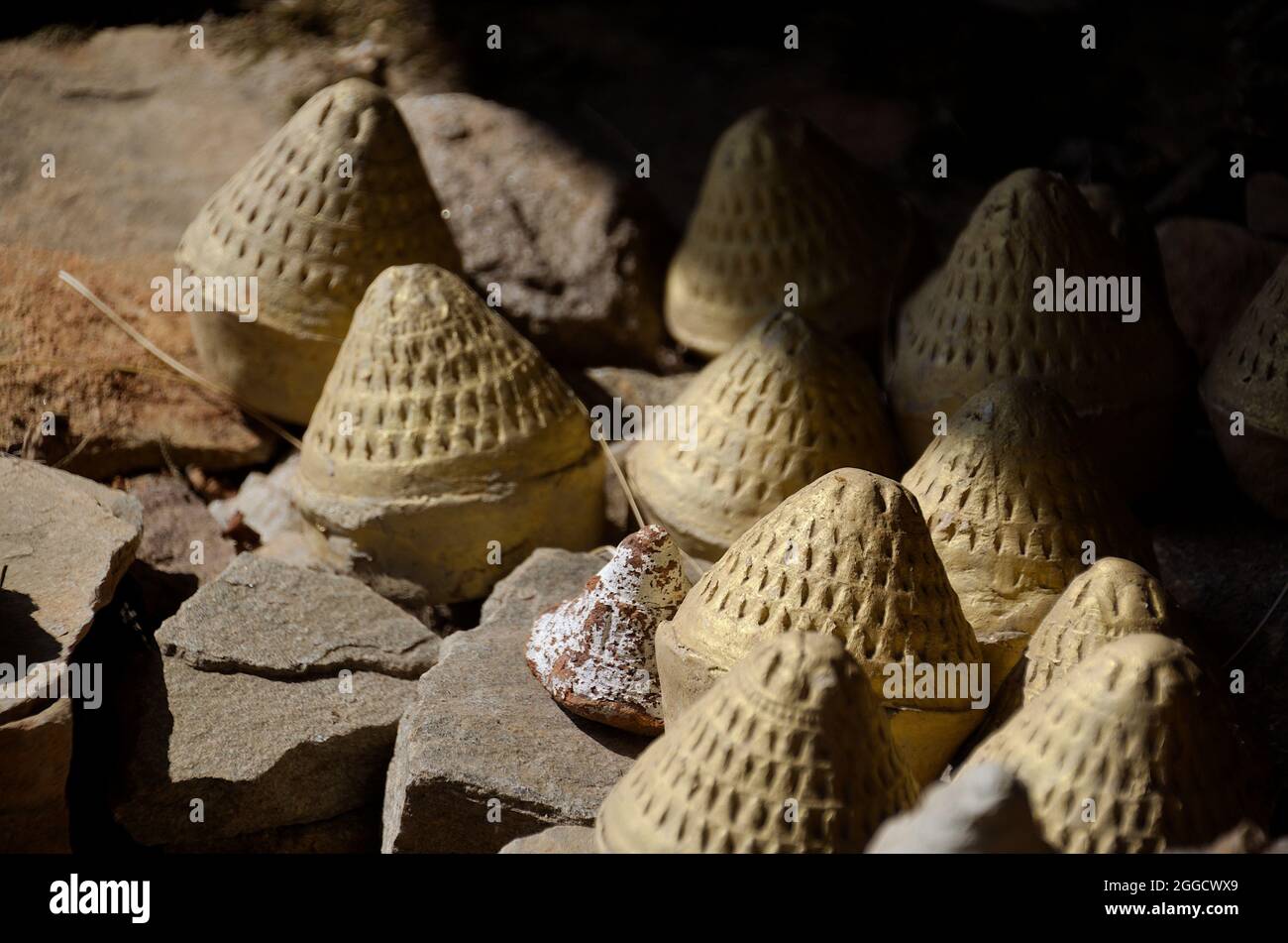 Close-up of Tsa-Tsas: clay votives in the shape of cylindrical cones or stupas, placed along the Paro Taktsang (Tiger Nest's) trail, Bhutan Stock Photo