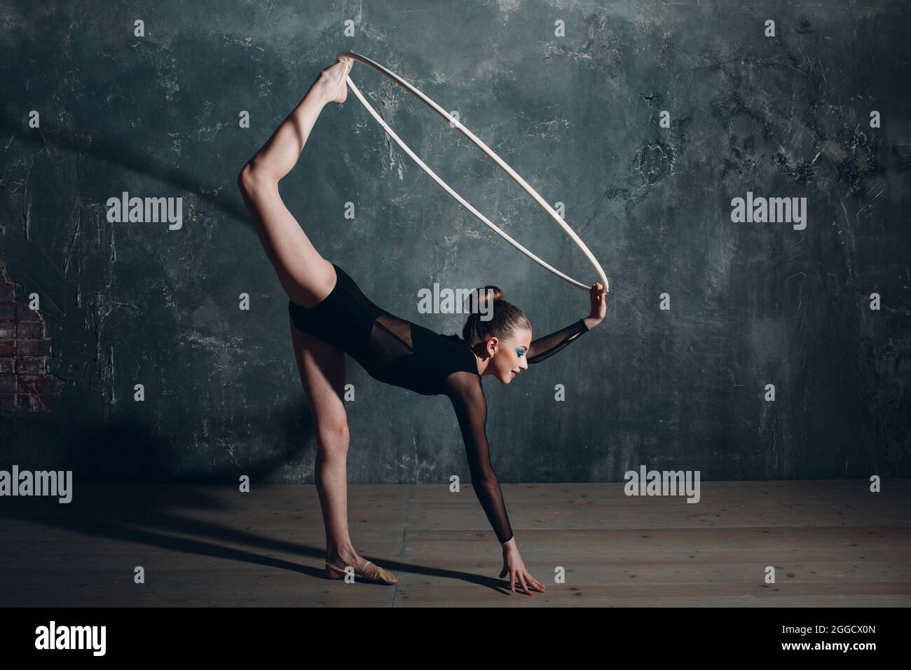 Young girl professional gymnast woman dance rhythmic gymnastics with ribbon  at studio Stock Photo - Alamy