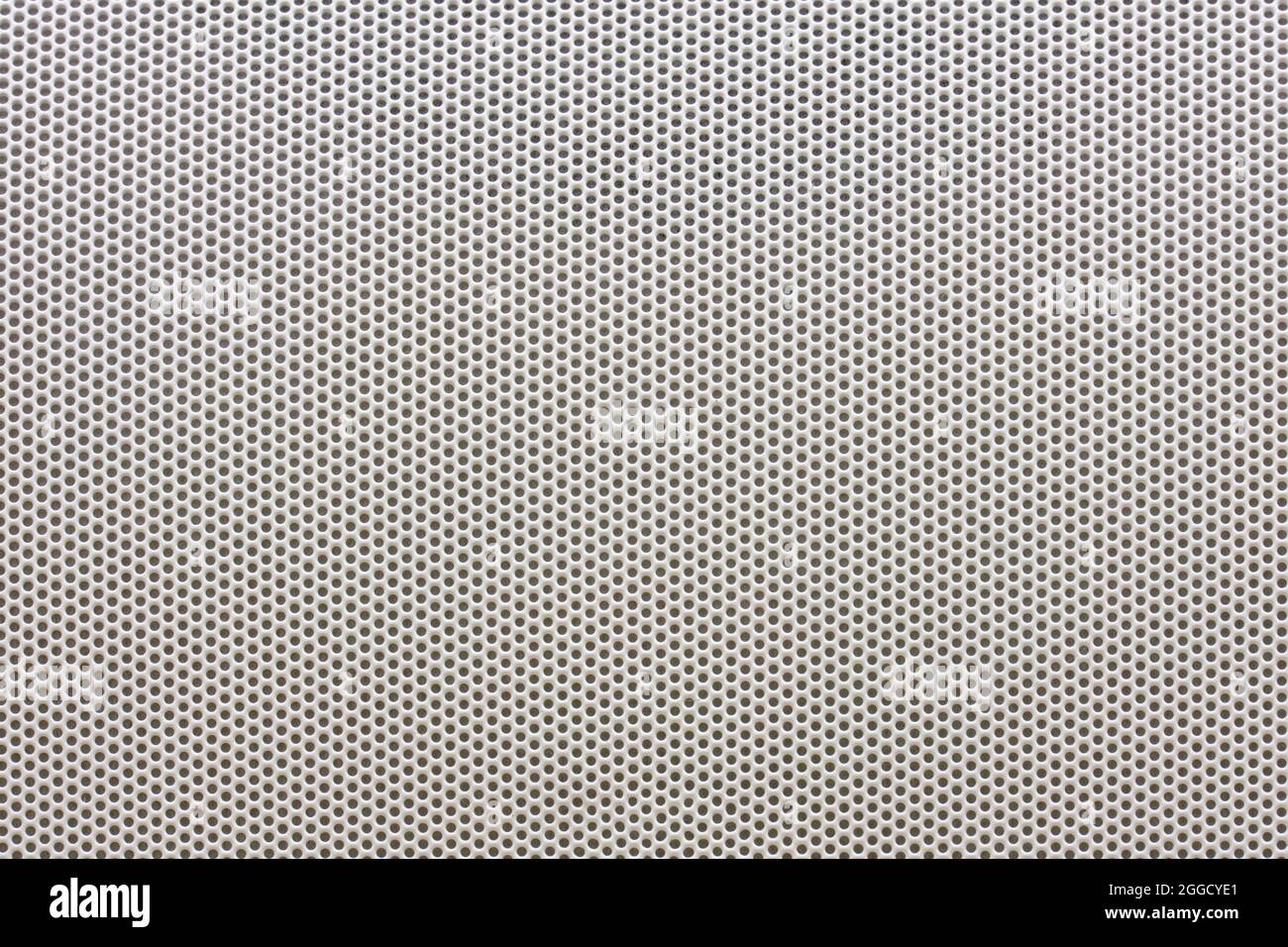 Silver speaker metal mesh texture, background with small holes Stock