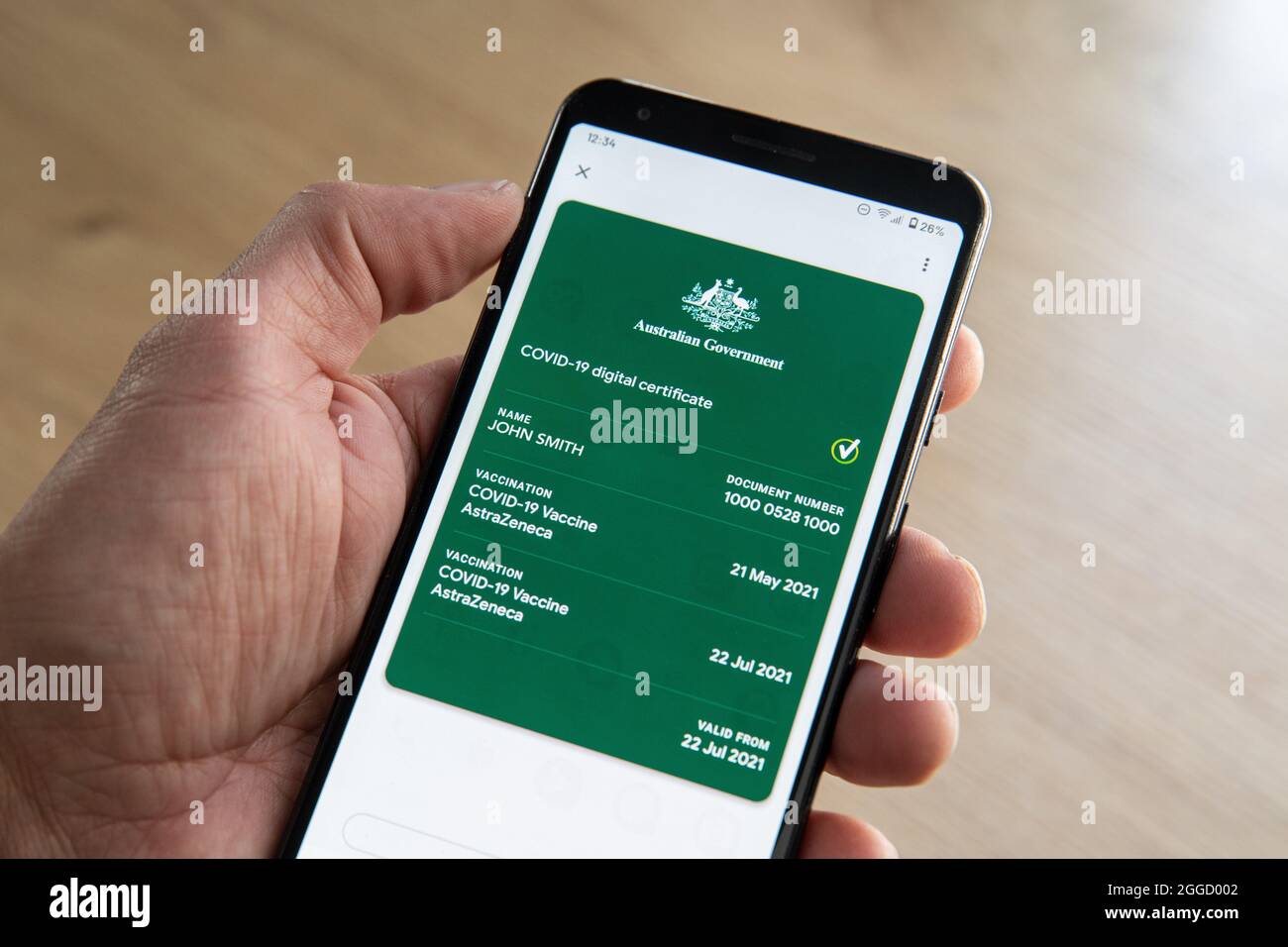 The Australian digital Covid-19 Vaccination certificate as displayed on a phone.  (The name and number has been changed on this image) Stock Photo