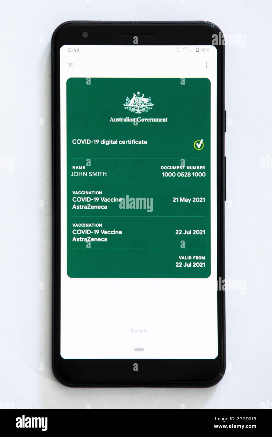 The Australian digital Covid-19 Vaccination certificate as displayed on a phone.  (The name and number has been changed on this image) Stock Photo