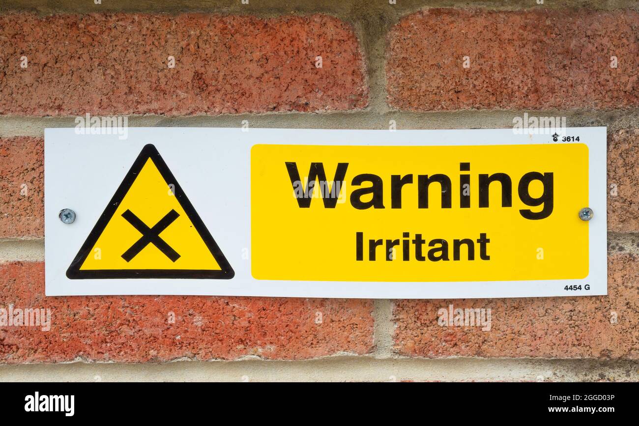 Sign warning of  an irritant in treated water in a fountain Stock Photo