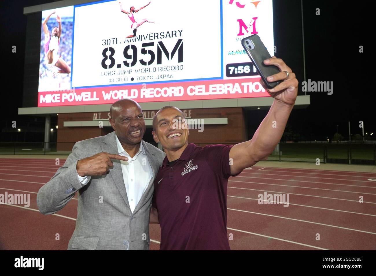 Mike Powell (USA), left, poses for a selfie with Giovanni Lanaro at a ceremony to commemorate the 30th anniversary of his long jump world record, Mond Stock Photo