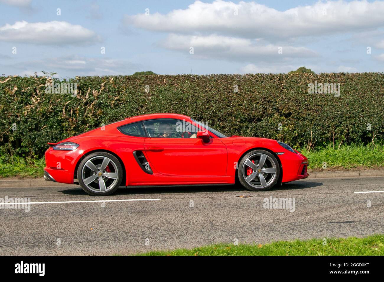 2017 red Porsche Cayman S PDK 7 speed automatic 2497cc petrol sports car, en-route to Capesthorne Hall classic August car show, Cheshire, UK Stock Photo