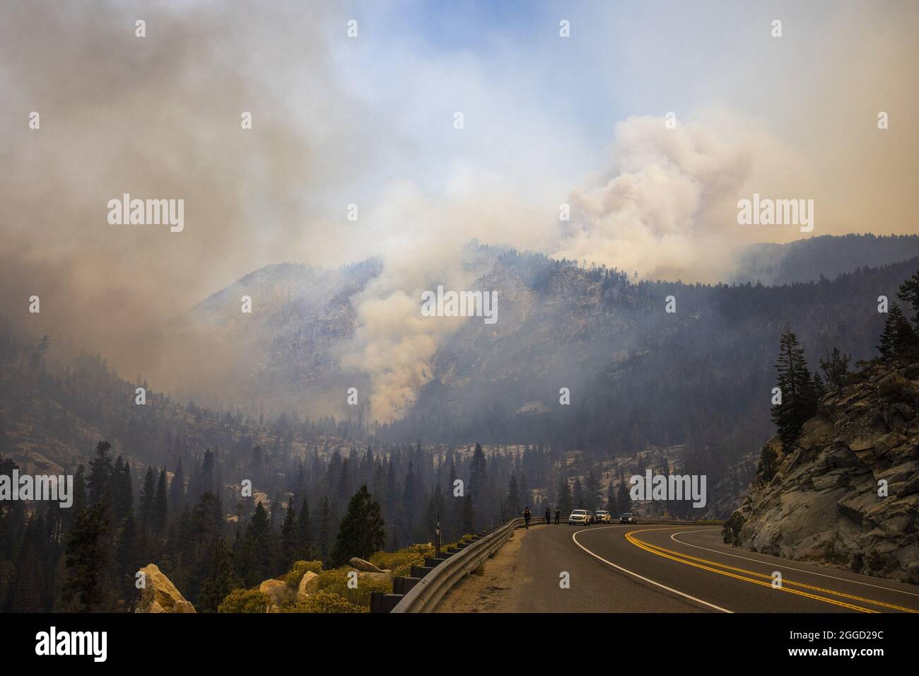 Smoke from the Caldor fire rises from Ralston Peak along HWY 50 near