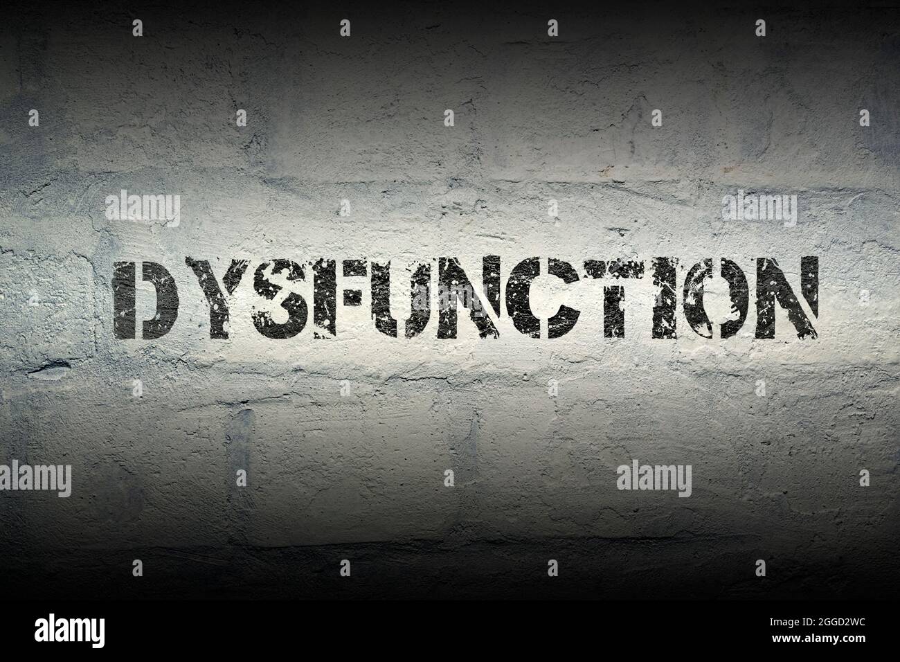 dysfunction stencil print on the grunge white brick wall Stock Photo