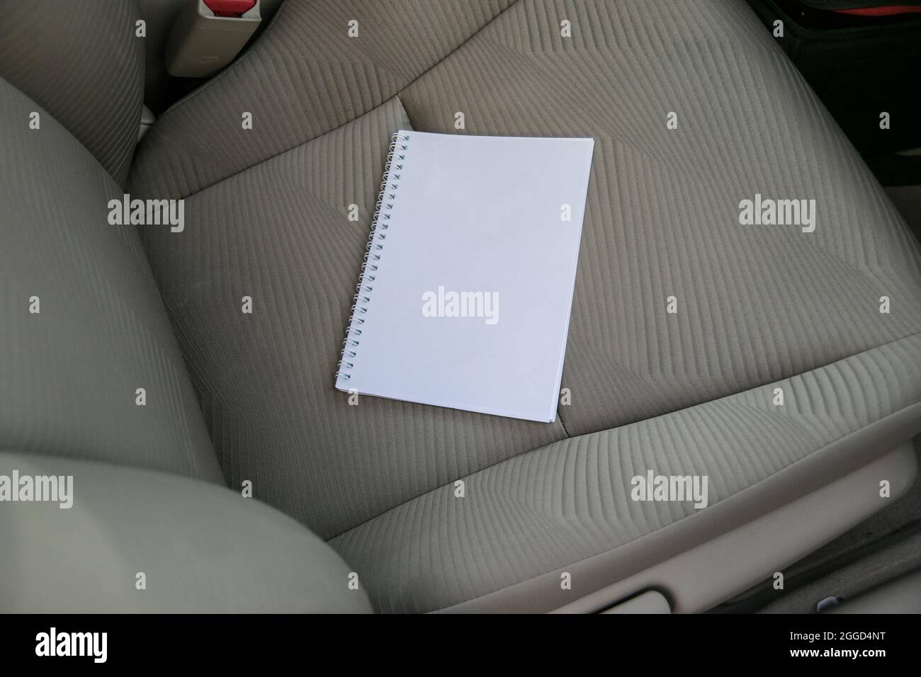 Open Notebook with Blank White Empty Clear Pages on the Car Sit Stock Photo