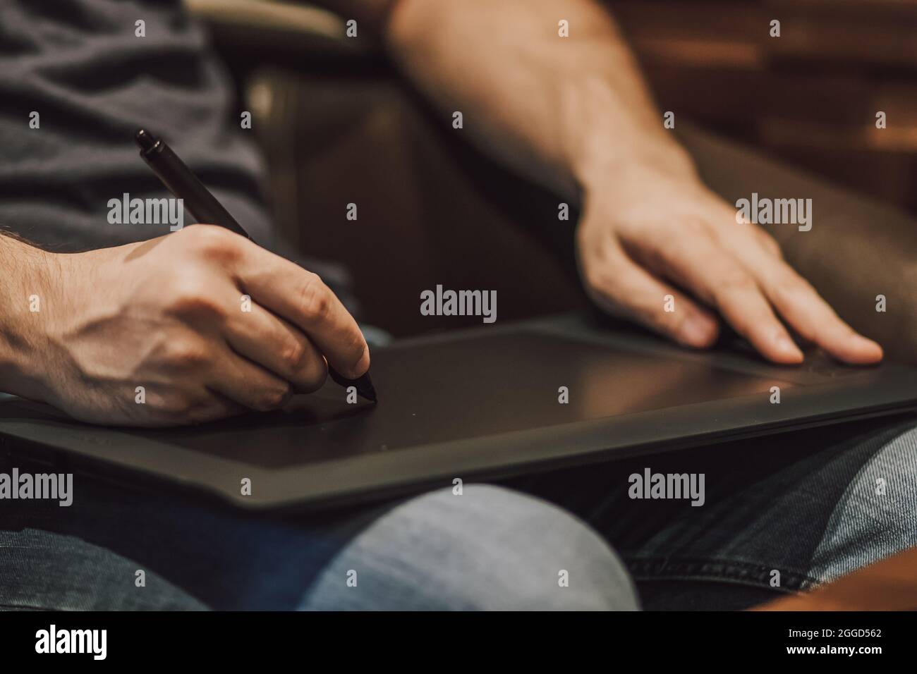 Close Up of a Person Drawing on a Graphics Tablet Stock Photo