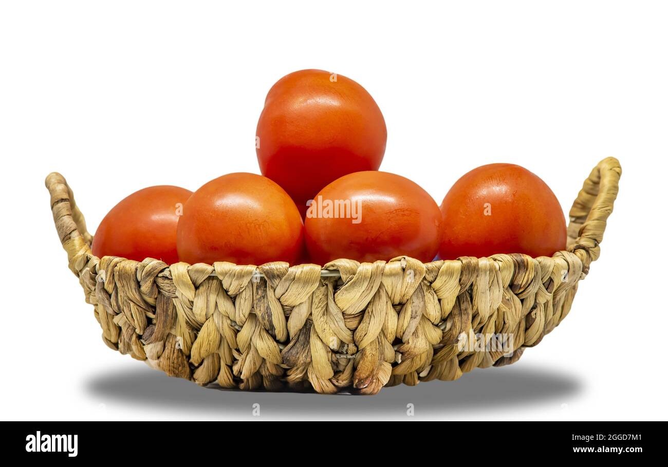 Basket filled with tomatoes isolated on a white background Stock Photo ...