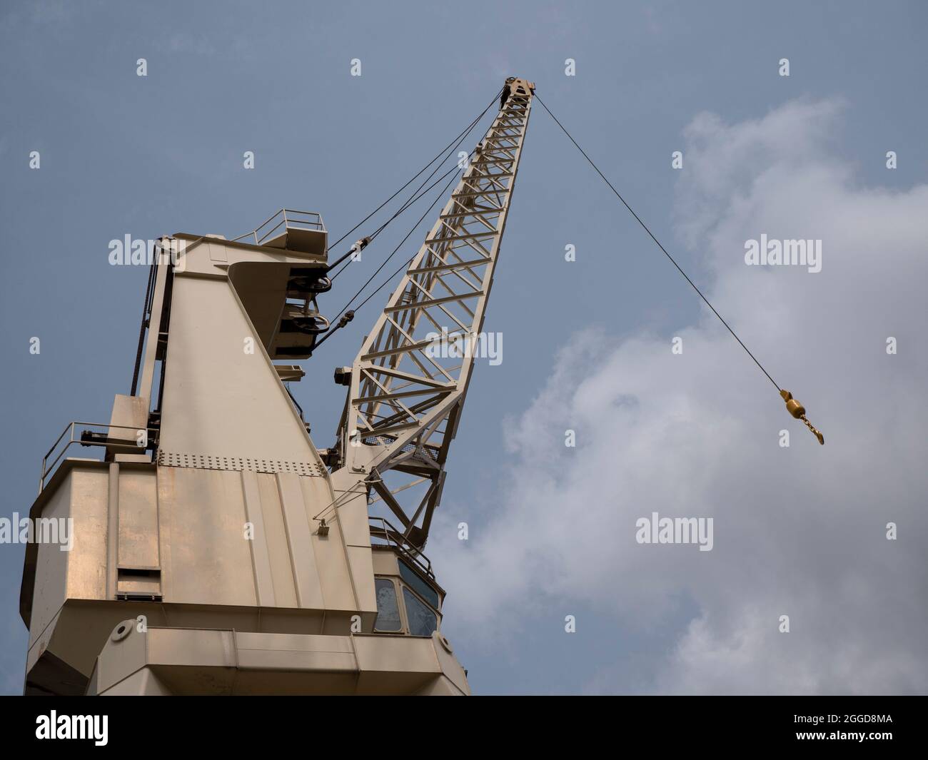 Side view of a harbor crane or rocker crane on the quay of Antwerp in Belgium on the river Scheldt Stock Photo