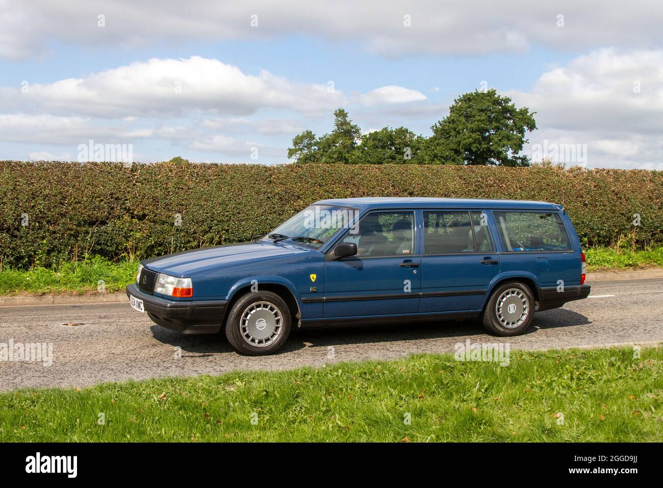 1982 80s blue Volvo 940 GL 5 speed manual 1986cc estate en-route to Capesthorne Hall classic August car show, Cheshire, UK Stock Photo