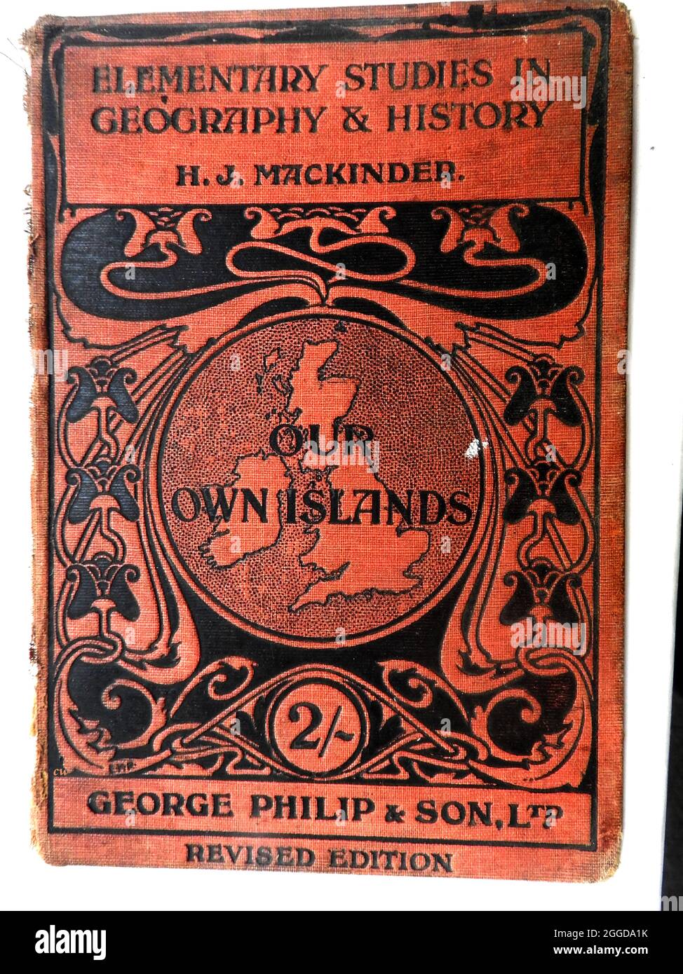 A 1914 British school geography book cover 'OUR OWN ISLANDS Elementary studies in Geography & History'.   --   A revised hardback edition published by George Philip and son Ltd (editor H J Mackinder). The publishing house was founded by George Philip (1800–1882)  who was a cartographer and  map publisher. It sold at 2/- (two shillings) a copy at the start of WWI. Stock Photo