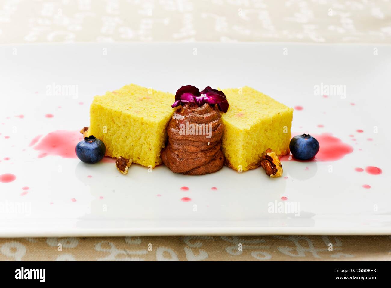 Saffrons spongecake with chocolate and blueberry Stock Photo Alamy