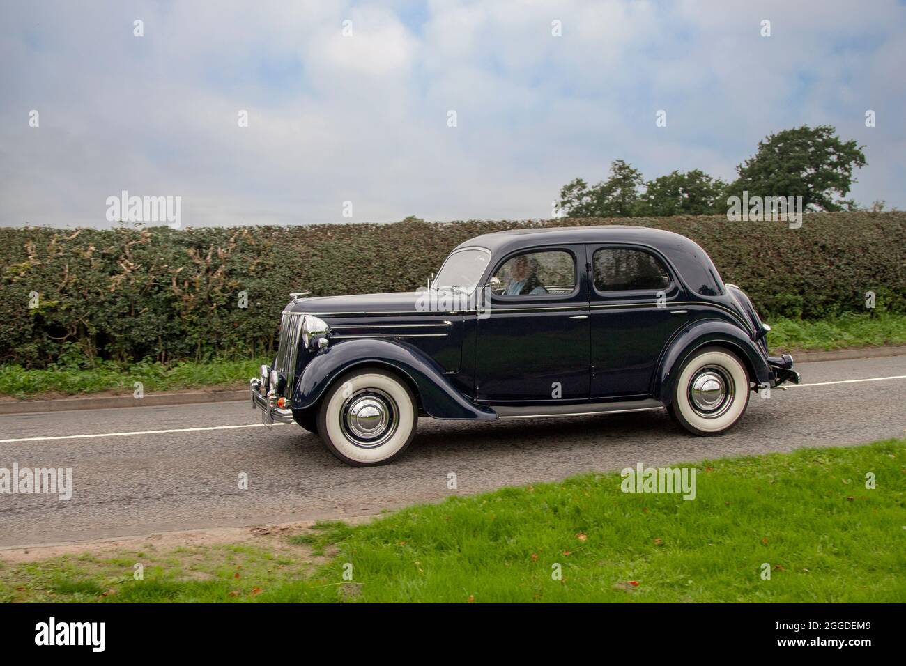 1950 50s fifties black Ford Pilot 4dr 3622cc petrol sedan en-route to Capesthorne Hall classic August car show, Cheshire, UK Stock Photo