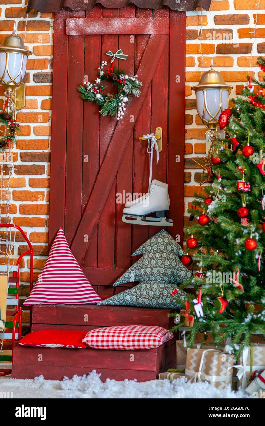2022. Christmas Tree With Christmas Toys: Wooden Sleigh, Small Bird, Cones, Balls, Colored Lights.concept: New Year, Christmas, Greeting Card, Celebra Stock Photo - Alamy
