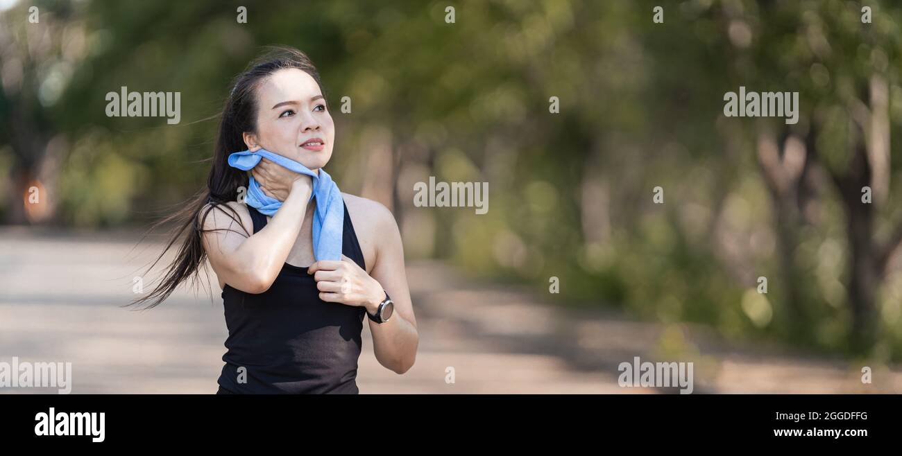 Cheerful Southeast Asian Female Runner In Sports Attire Do Some