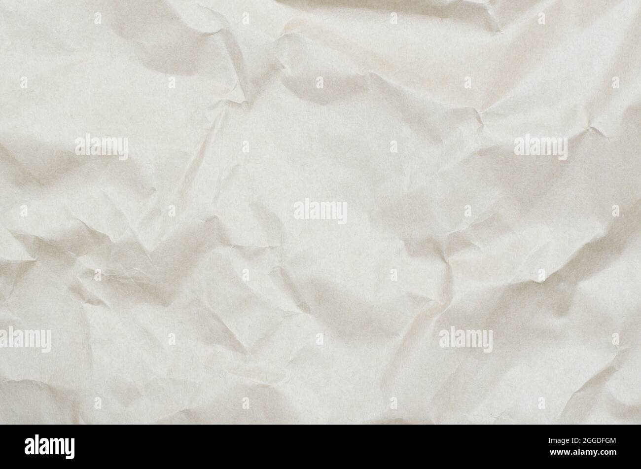 Background from crumpled beige paper. Texture of crumpled paper Stock Photo