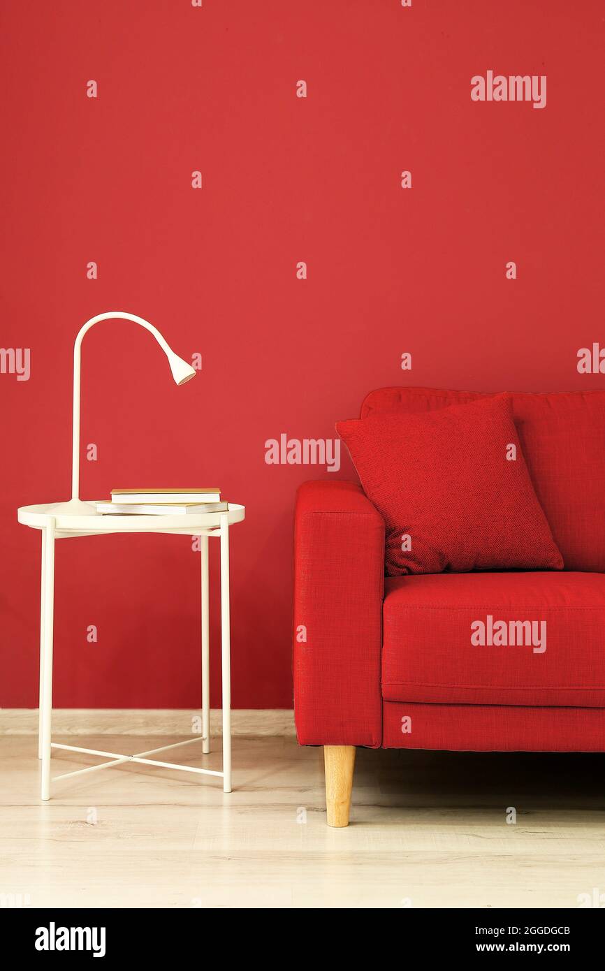 Interior of stylish living room with sofa and table Stock Photo - Alamy