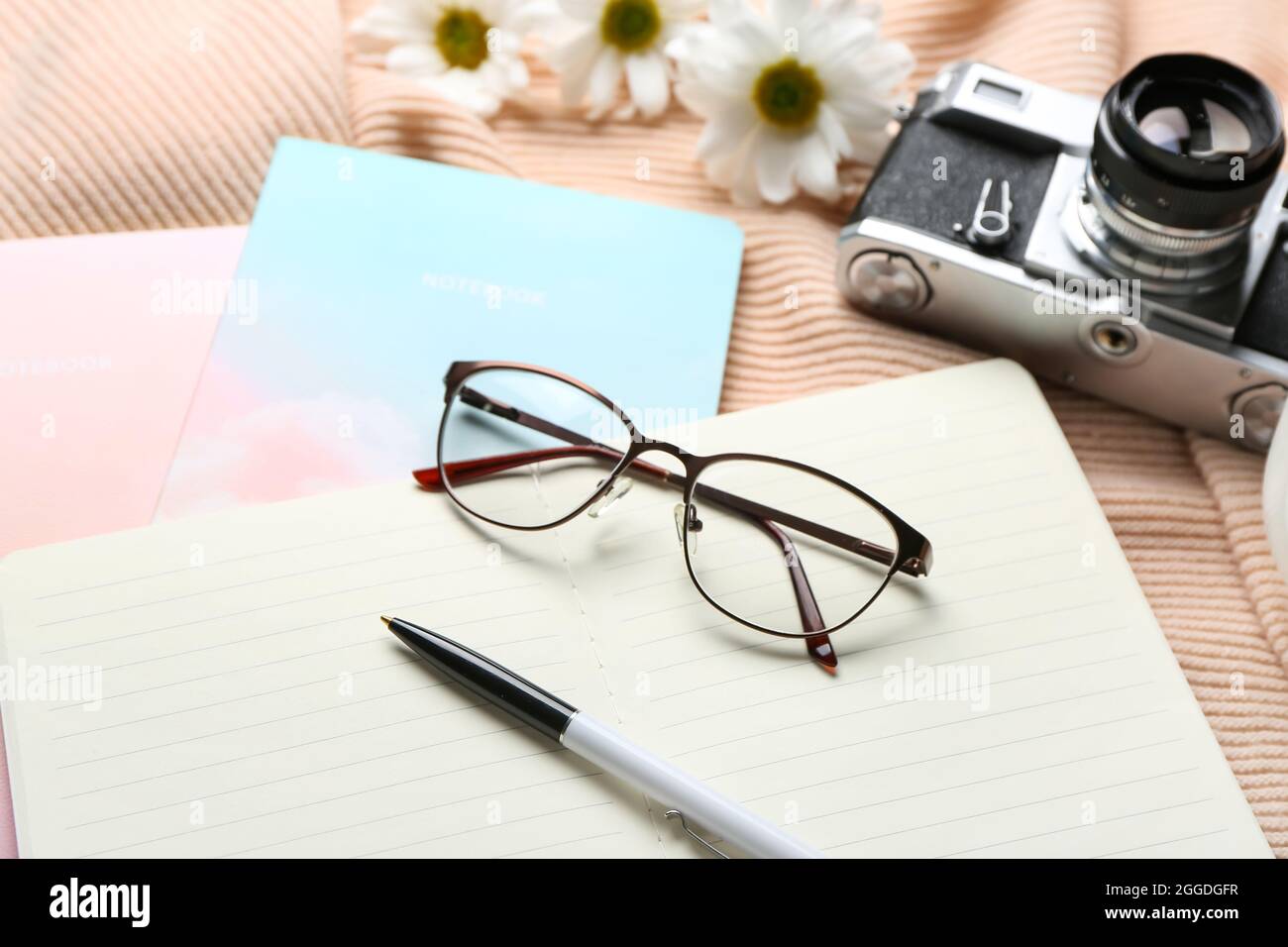 Composition with notebooks, eyeglasses and photo camera, closeup Stock ...