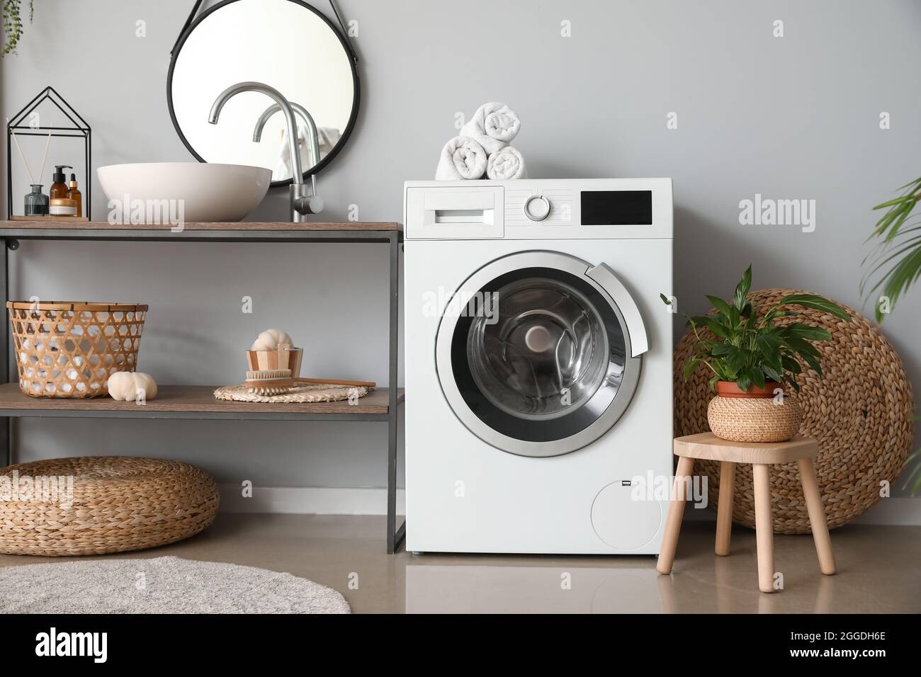 Modern washing machine in bathroom Stock Photo Alamy