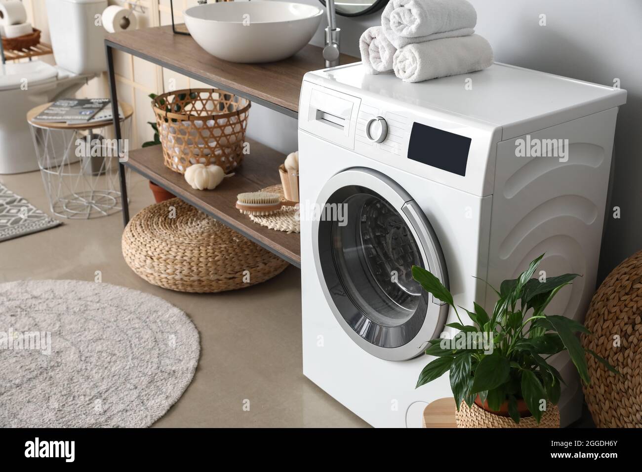 Modern washing machine in bathroom Stock Photo Alamy