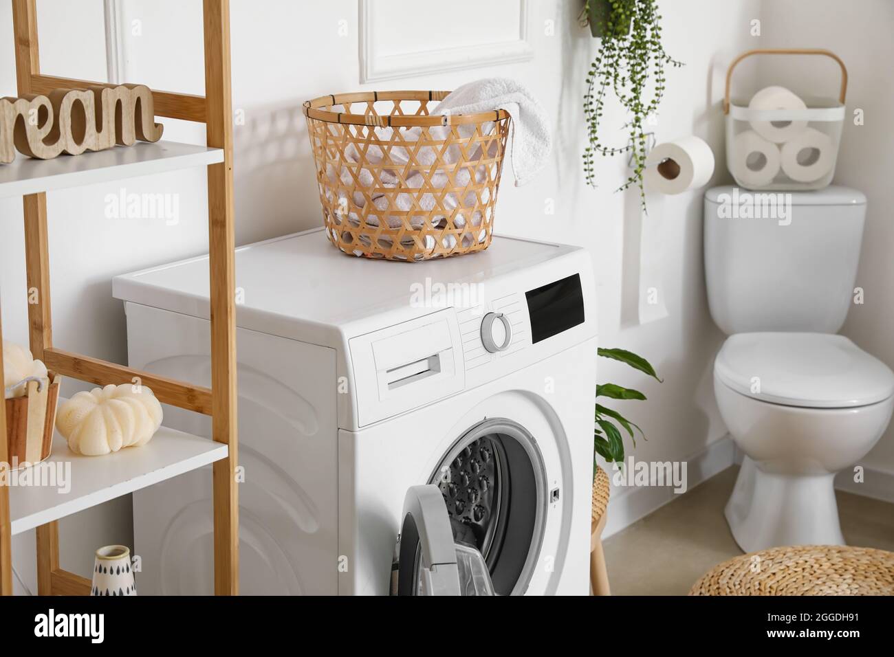 Modern washing machine in bathroom Stock Photo Alamy