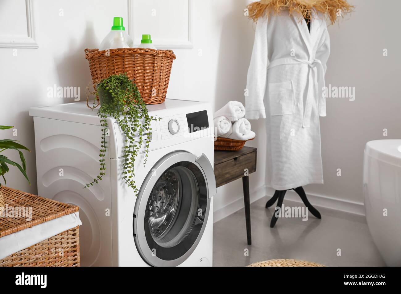 Modern washing machine in bathroom Stock Photo Alamy