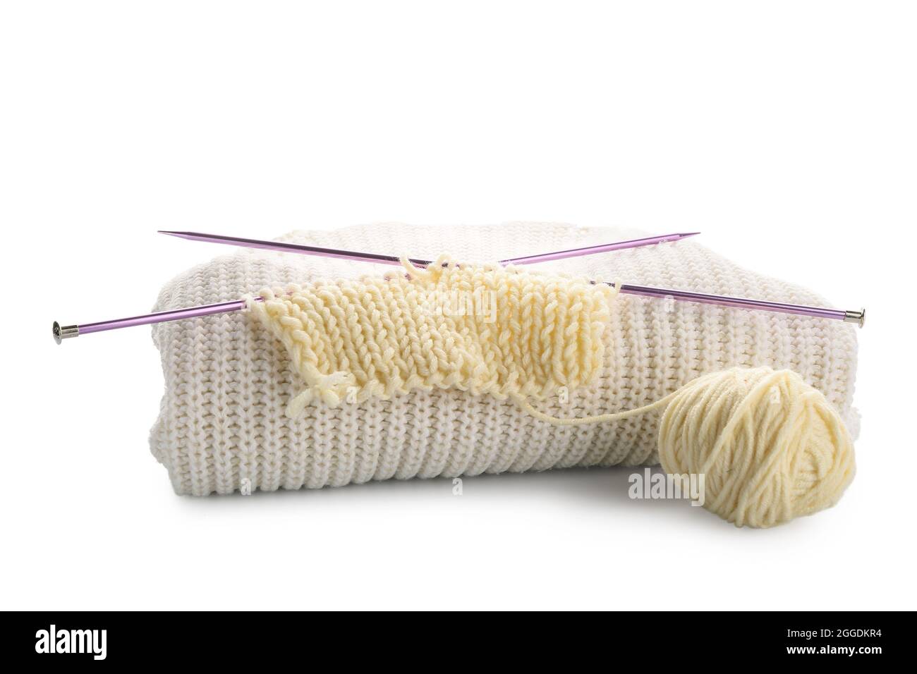 Yarn with knitting needles and plaid on white background Stock Photo ...